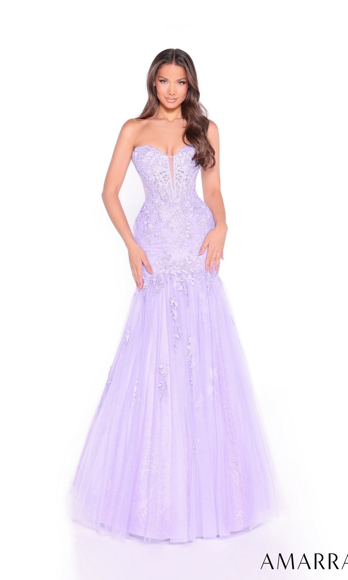 A woman wearing the Amarra 89319 long prom dress with a lace bodice and light purple mermaid tulle skirt stands against a plain white background.
